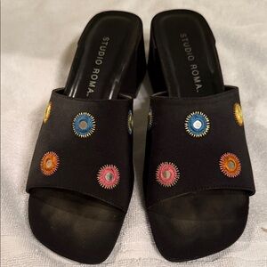 Black slip on sandals with colorful mirrored ornaments
